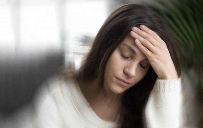 Doctor examining patient experiencing sudden vertigo and dizziness balance problems.